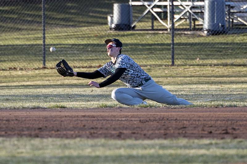 Rock Falls’ Carter Schueler makes a lunging catch after a long run for an Monday, March 27, 2023 versus Erie-Prophetstown.