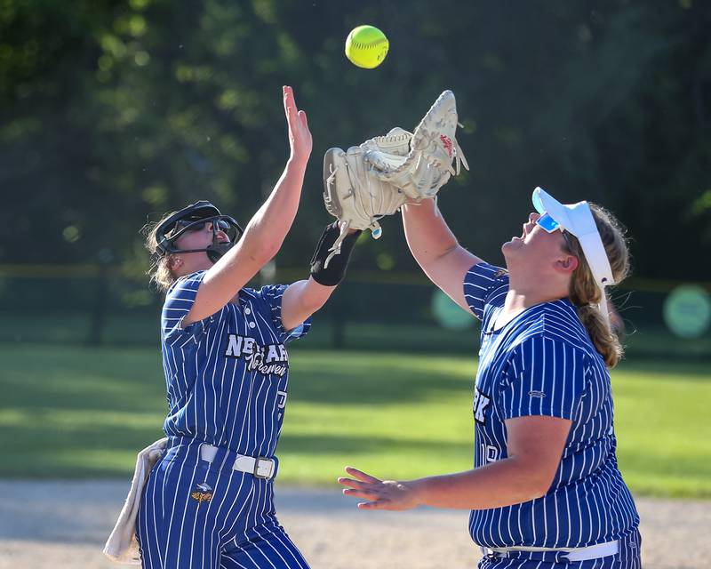 Newark's Kodi Rizzo (L) and Newark's Kate Bromeland (19) both go for a pop up during Class 1A Newark Regional final game between St. Edwards at Newark. May 17th, 2024.