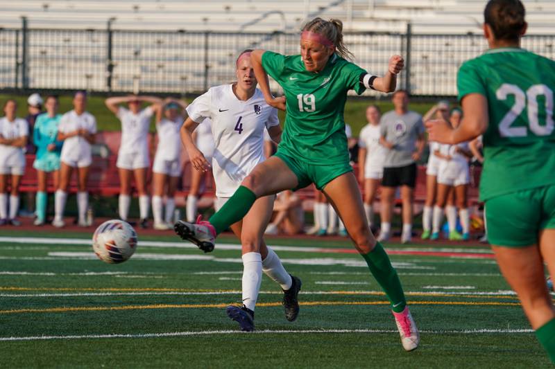 York’s Ava Hansmann (19) plays the ball in the box against Downers Grove North's Annika Issacson (4) during a Class 3A Hinsdale Central Sectional semifinal soccer match at Hinsdale Central High School in Hinsdale on Tuesday, May 21, 2024.