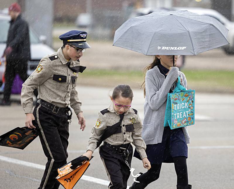 Wind and rain tried to stop the fun Friday, Oct. 27, 2023 in Rock Falls. Visitors also ducked into downtown businesses to escape the rain.