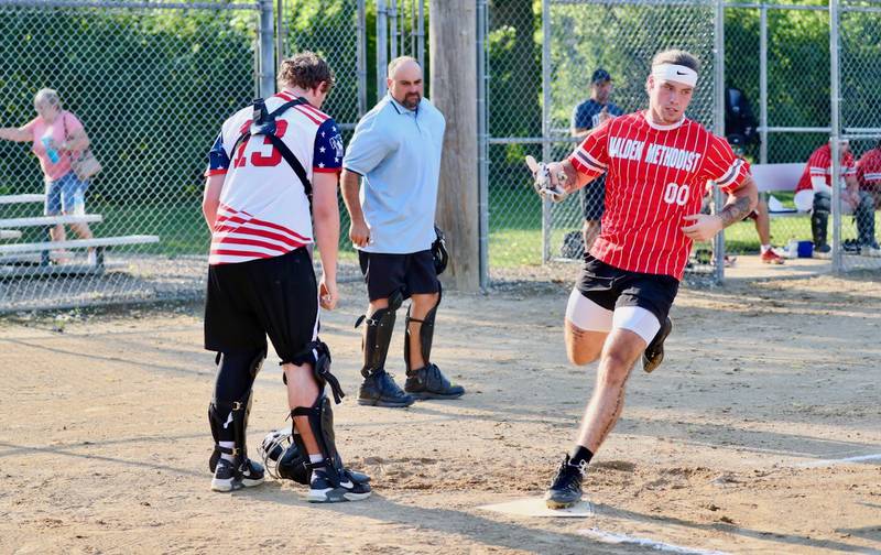 Noah Atkinson scores a run for Malden Methodist in Friday's Princeton Park District Fastpich League tournament play at Westside Park.