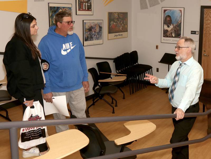Sophia and John Raimondi of Oswego talk with Waubonsee Community College Professor of Music, Mark Lathan at the Transfer and Career Open House at the Sugar Grove Campus on April 20, 2024.