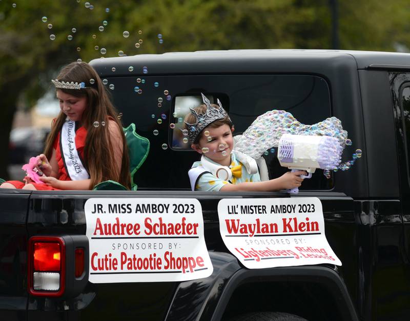 Amboy's 2023 Lil' Mister Waylan Klein shoots bubbles at the crowd as he rides with Jr. Miss Amboy 2023 Audree Schaeger in the ByronFest parade on Saturday, July 13, 2024 in Byron.