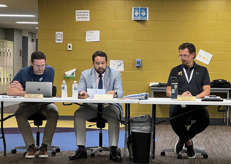 Sycamore school board member Eric Jones, board president Michael DeVito and Superintendent Steve Wilder on Aug. 27, 2024 attended a board of education meeting inside Sycamore Middle School.