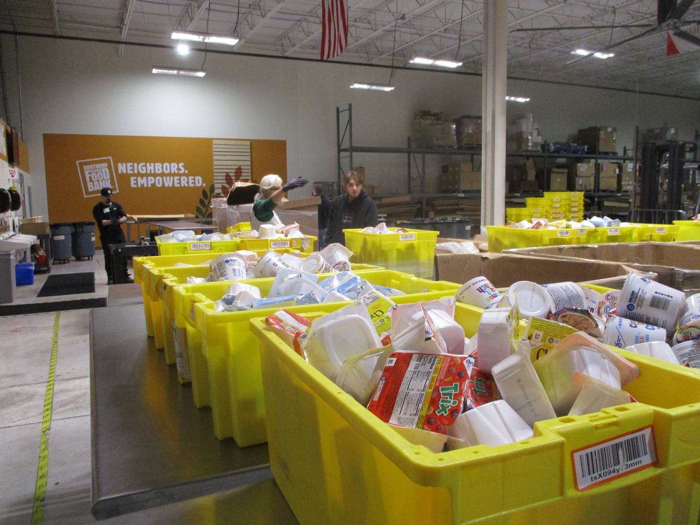 Crates filled with cereal boxes await distribution from the Northern Illinois Food Bank South Suburban Center in Joliet. Feb. 24, 2024.