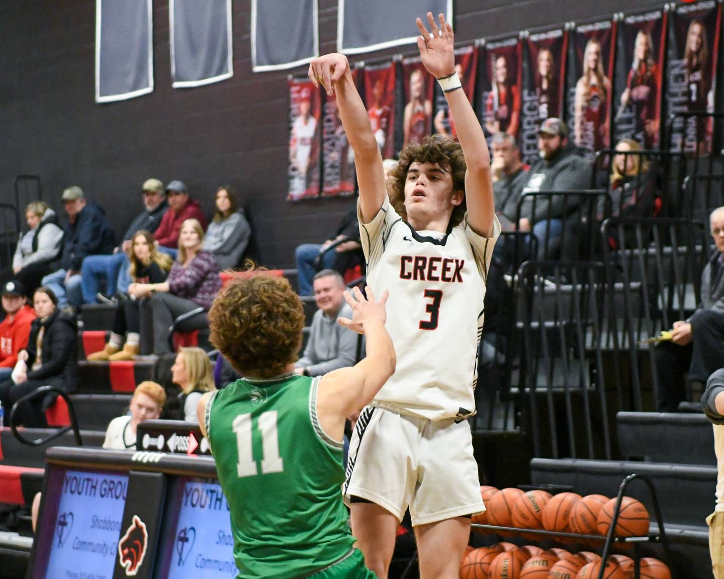 Indian Creek's Logan Schrader (3) takes a shot over Dwight's Joey Starks (11) during the regional quarter final game on Monday Feb. 19, 2024, held at Indian Creek High School.