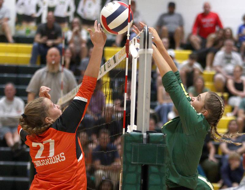 Crystal Lake South’s Bobbi Wire, right, and McHenry’s Riley Ten Bruin battle at the net in varsity volleyball on Tuesday, Sept. 17, 2024, at Crystal Lake South High School in Crystal Lake.