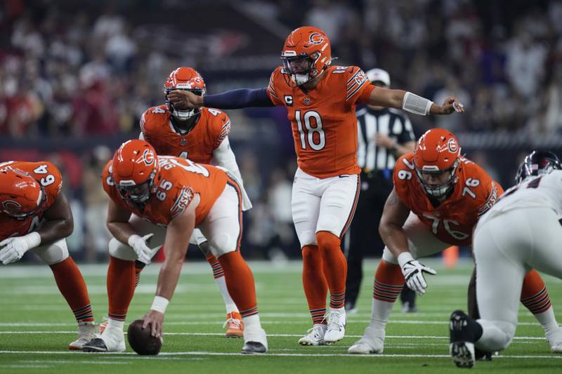 Chicago Bears quarterback Caleb Williams (18) prepares to take a snap during an NFL football game against the Houston Texans Sunday, Sunday, Sept. 15, 2024, in Houston.