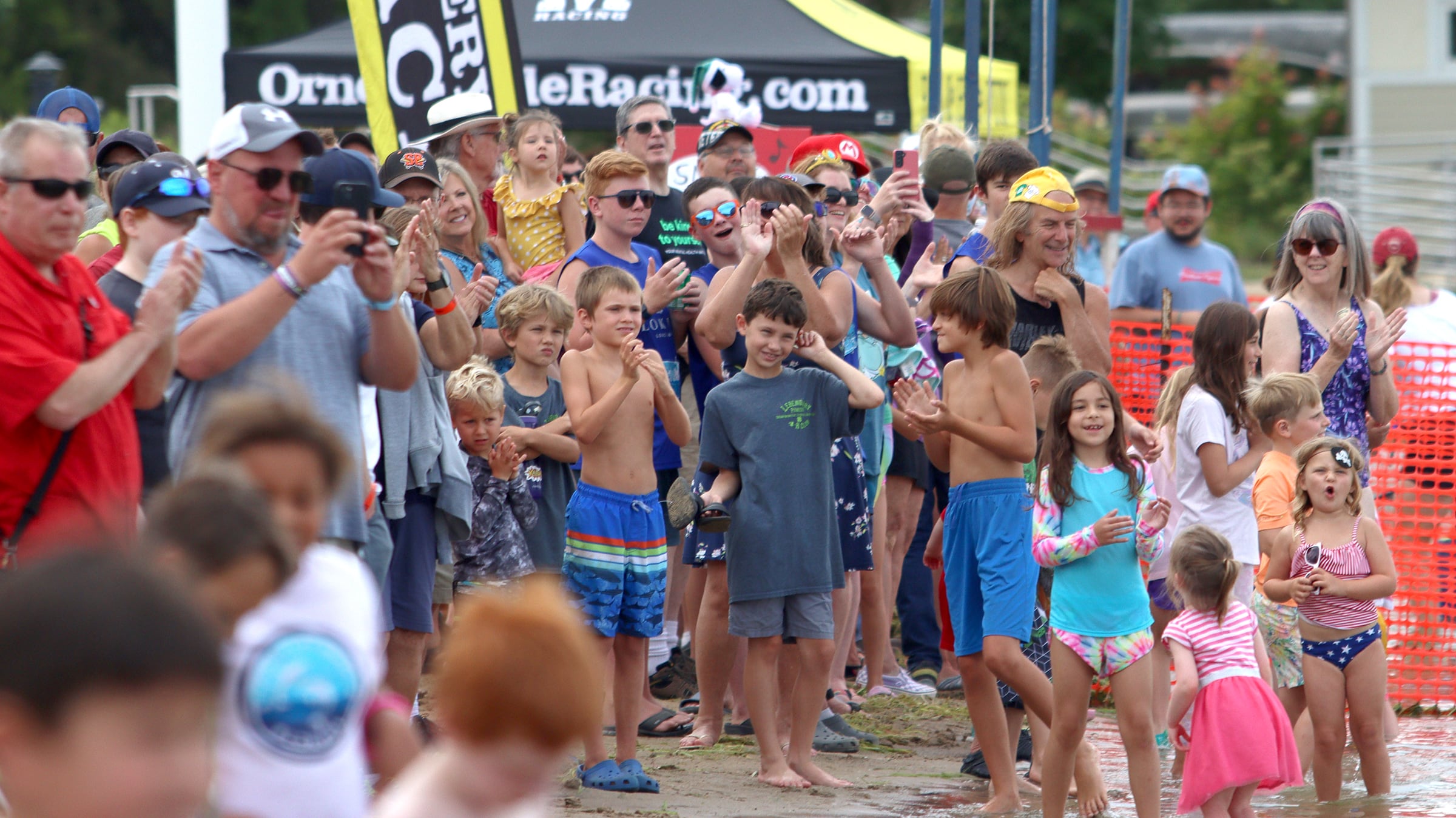 Crowds watch from Main Beach during the Cardboard Regatta on Crystal Lake Saturday.