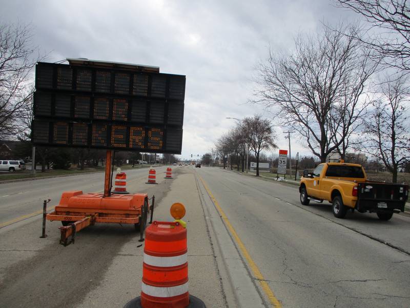 An electronic sign warns southbound motorists on Houbolt Road in Joliet of construction activity that has started around the Interstate 80 interchange on Tuesday, March 22, 2022.