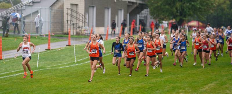 The runners take to the course during the girls varsity Dukane Conference Cross Country Championships at Lake Park High School in Roselle on Saturday, Oct. 14, 2023.