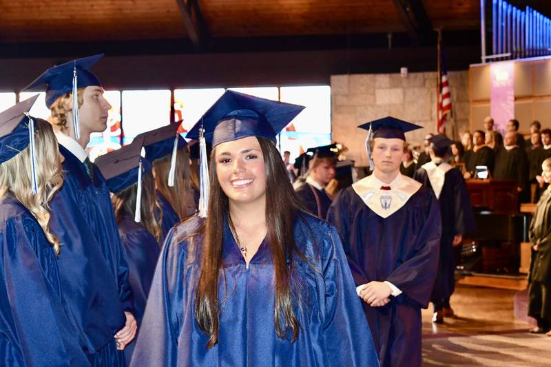 Nazareth Academy graduates Dominique Chlada and Tommy Chopp process into the sanctuary during the school’s commencement ceremony at Christ Church in Oak Brook on Sunday, May 19, 2024.