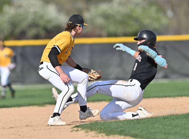 Joliet West's Cael Karczewski  attempts to tag out Lincoln-Way West's Conor Essenburg  during the non-conference game on Friday, April. 19, 2024, at Joliet.