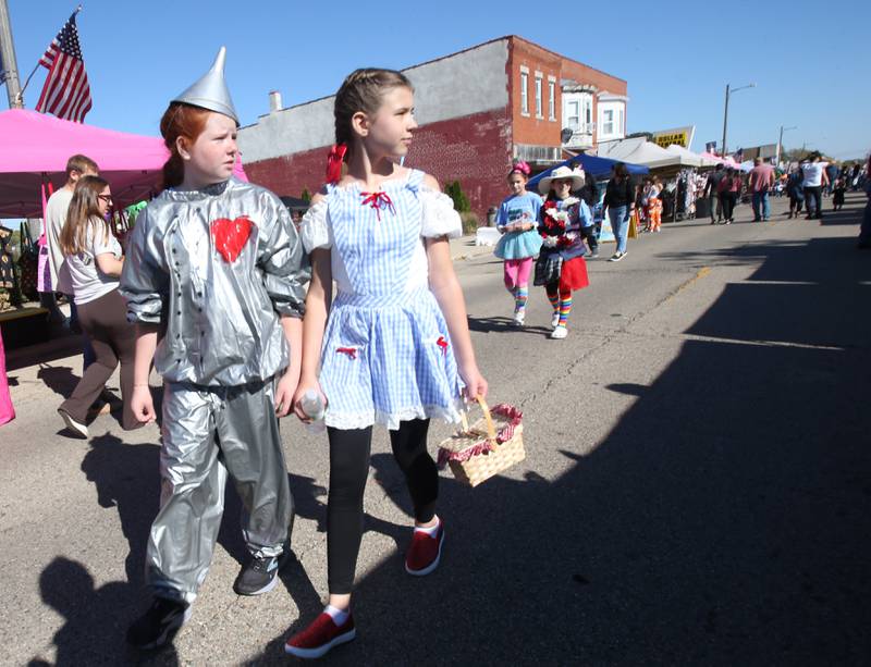 Ruvy Stash and Gabby Smith dress as the Tin Man and Dorthy from the "Wizard of Oz" during the Oglesby Harvest Fest on Saturday Oct. 19, 2024 in Oglesby.