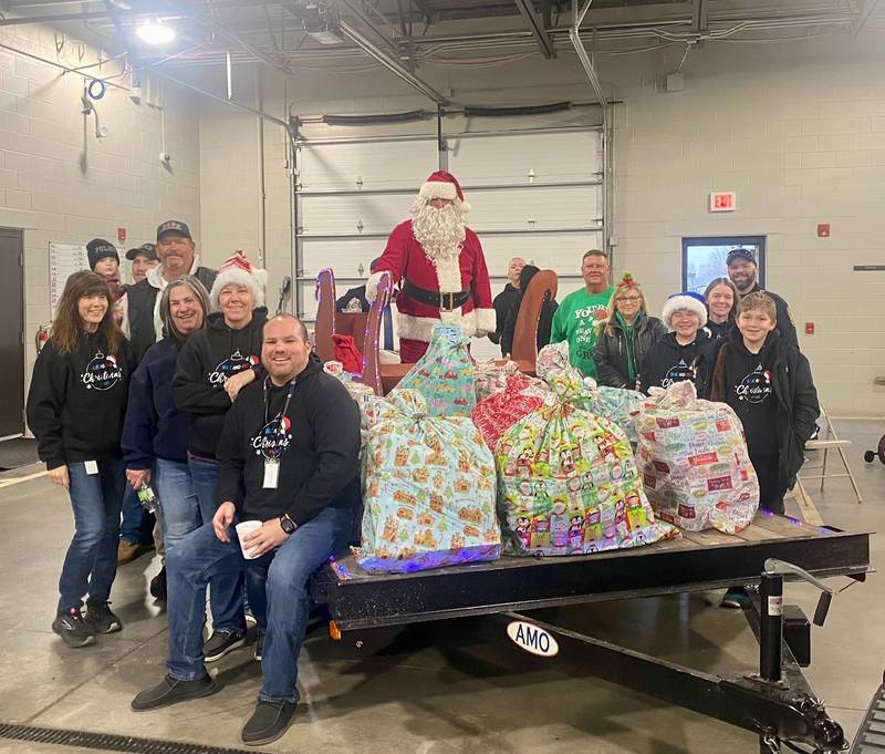 Members of the Peru police and fire departments came out Thursday, Dec. 21 with their friends and family to deliver gifts as a part of the Blue and Red Christmas program.