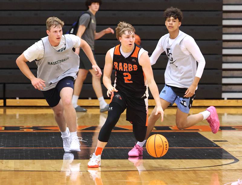 DeKalb’s Sean Reynolds pushes the ball upcourt during their summer game against Elk Grove Tuesday, June 18, 2024, at DeKalb High School.