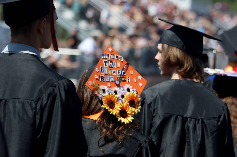 Members of the Class of 2024 march to McHenry High School’s 104th Annual Commencement at McCracken Field on Saturday.