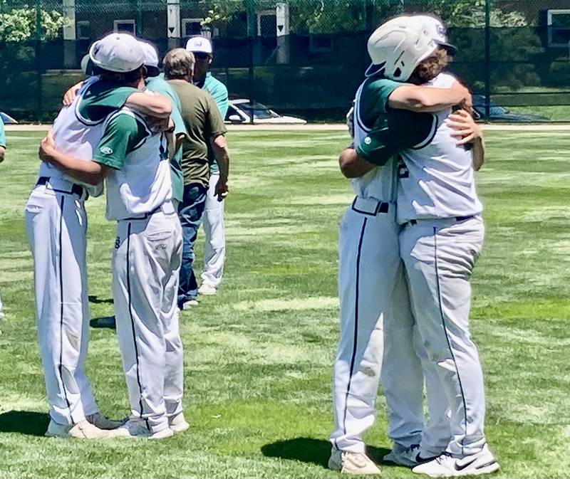 St. Bede players embrace with the emotions of a season-ending 4-2 loss to Annawan-Wethersfield in Saturday's 1A Bloomington Sectional championship game. The Bruins bow out with a 21-15-1 record.