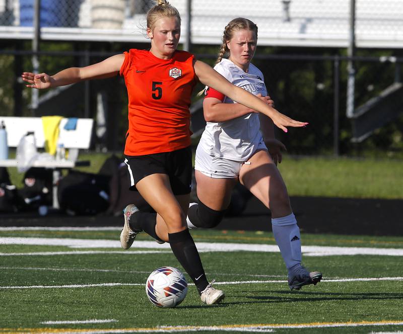 Crystal Lake Central's Lizzie Gray pushes the ball forward in front of Wauconda's Sophie Kloss during the IHSA Class 2A Grayslake North Regional championship soccer match on Friday, May 17, 2024, at Grayslake North High School.