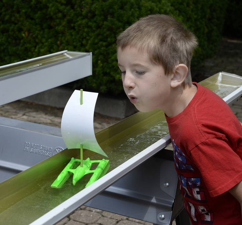 Jacob Janke uses wind power to get his small boat moving in a canal Saturday, July 8, 2023, at the Ottawa Historical and Scouting Heritage Museum during Canal Day celebrating the 175th anniversary of the Illinois and Michigan Canal opening.