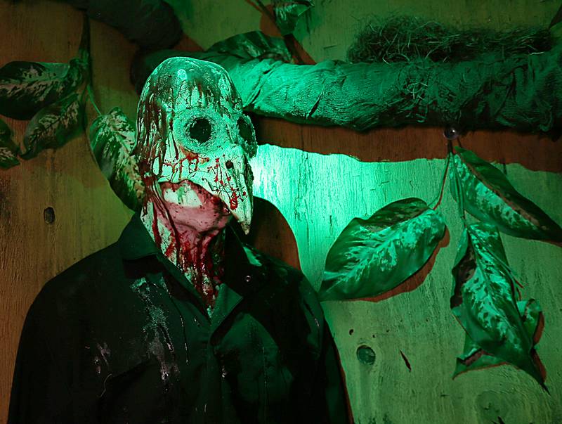 An actor poses for a photo at the Insanity Haunted House inside the Peru Mall on Thursday, Oct. 6, 2022.