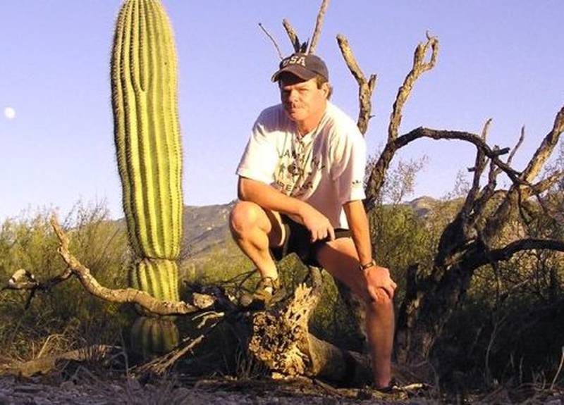 McHenry City Council Alderman Frank McClatchey, hiking a few years ago in the Arizona desert. McClatchey is participating in a local version of Survivor, simply called Survive.