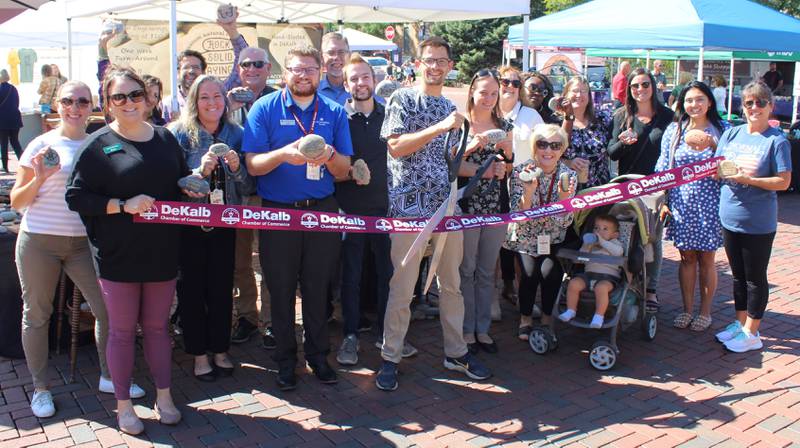 The DeKalb Chamber of Commerce welcoming Rock Solid Sayings with a ribbon-cutting