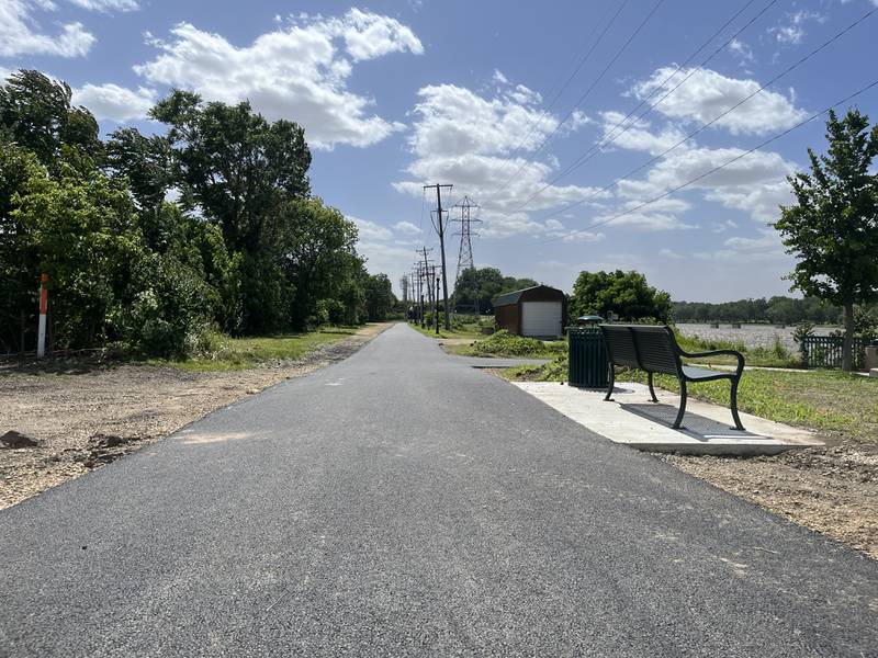 Pavement was laid last week to replace the gravel trail along the Illinois Transportation Enhancement Program multi-use path that runs west along the river with a ramp to the viaducts running to Seventh Street.