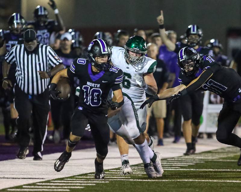 Downers Grove North's Oliver Thulin (10) runs down the sidelines after a catch during a football game between Glenbard West at Downers Grove North on Friday, Sept 13th, 2024  in Downers Grove.