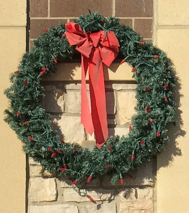 A red wreath displayed at the Plainfield Fire Protection District to promote holiday fire safety.