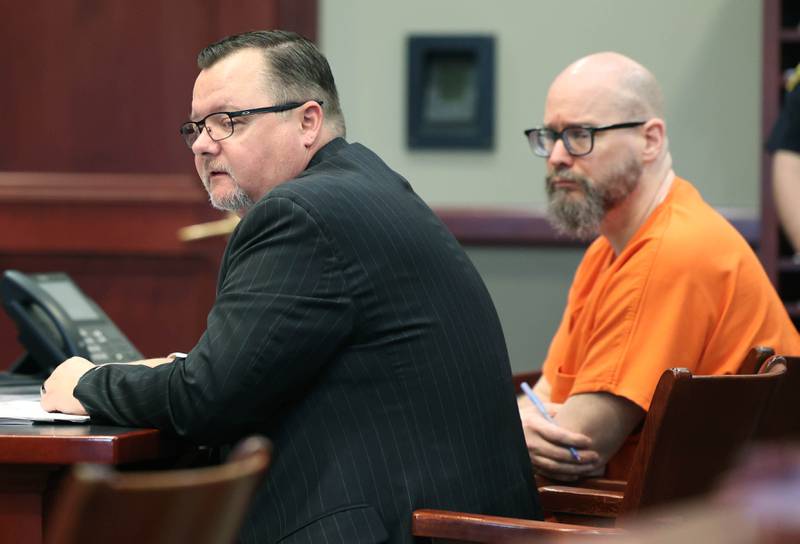Jonathan Hurst (right) and his attorney Chip Criswell listen to arguments by lead prosecutor Suzanne Collins in Judge Marcy Buick’s courtroom at the DeKalb County Courthouse in Sycamore Monday, April 29, 2024 during a hearing on his case. Hurst is charged with murder in the August 2016 slayings of mother and son, Patricia A. Wilson, 85 and Robert J. Wilson, 64, of Sycamore.