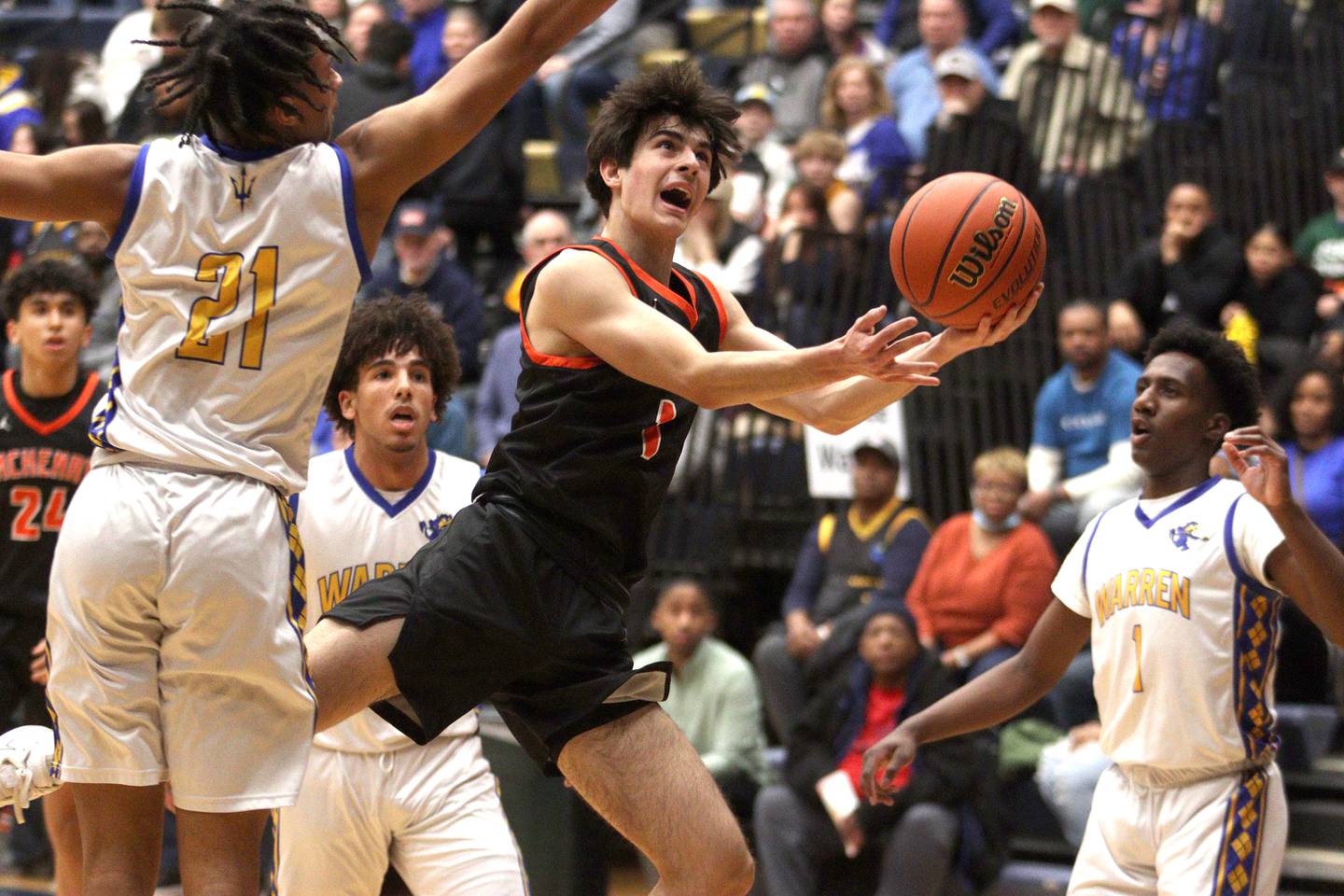 McHenry’s Marko Visnjevac works under the hoop against Warren during IHSA Class 4A Sectional Final action at Rock Valley College on Friday night.