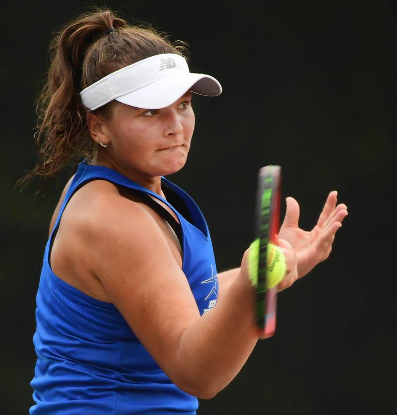 St. Charles North’s Alli Gizewicz returns a forehand against St. Charles East’s Kelsey Jacob at the DuKane Conference girls tennis tournament at Wheaton Warrenville South High School on Thursday, October 5, 2023.