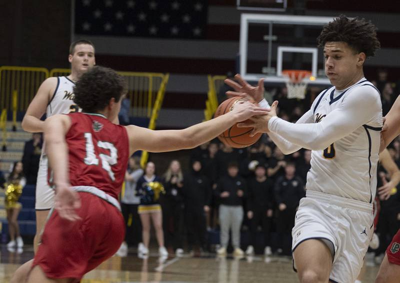 Sterling’s Andre Klaver has the ball stripped away by LaSalle-Peru’s Michael Hartman Friday, Feb. 23, 2024 during a class 3A regional final at Sterling High School.