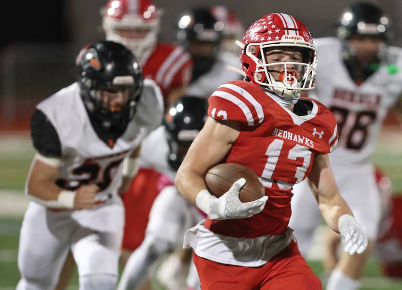 Naperville Central's Aiden Clark gets behind the DeKalb defense during their game Friday, Oct. 6, 2023, at Naperville Central High School.