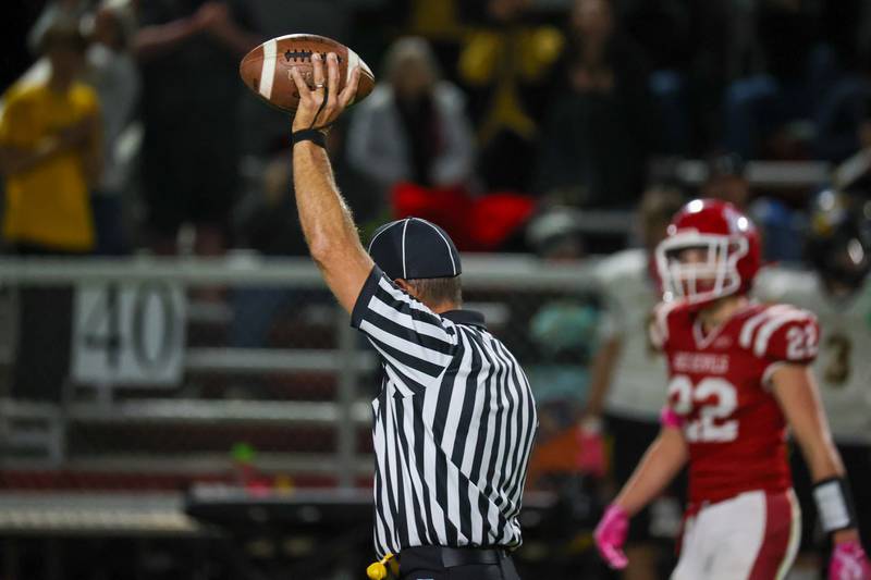 Referee holds ball over head on Friday, October 18, 2024 at Richard Nesti Stadium in Spring Valley.