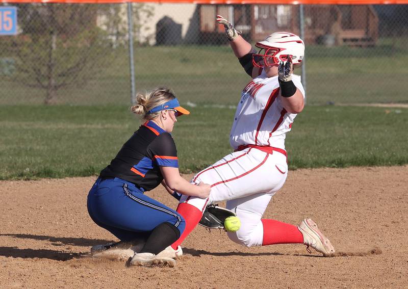 Genoa-Kingston’s Reagan Tomlinson tries to catch the throw as Oregon's Olivia Paul slides late into second base during their game Tuesday, April 9, 2024, at Genoa-Kingston High School.