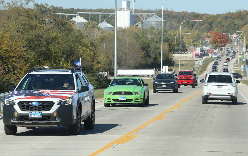 Cars carry Trump 2024 flags while leading others in the Trump Caravan over the Illinois Route 178 on Saturday, Oct. 19, 22024 in Utica.