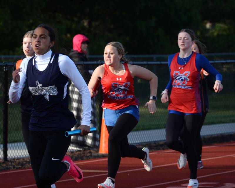 Morrison's Kiera Hudson (center) begins her leg of the 4x100 after getting the baton from Gracelyn Streets Wood at the Ed Schmidt Invitational Track Meet at Erie High School on Friday, April 19, 2024.