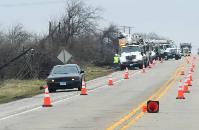 ComEd crews were busy working on the west side of  state Route 2 after an April 4 hail storm broke off electrical poles knocking electricity out to Grand Detour.
