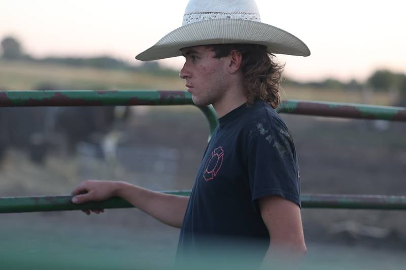 Dominic Dubberstine-Ellerbrock stands by to help after his bull riding practice. Dominic will be competing in the 2022 National High School Finals Rodeo Bull Riding event on July 17th through the 23rd in Wyoming. Thursday, June 30, 2022 in Grand Ridge.