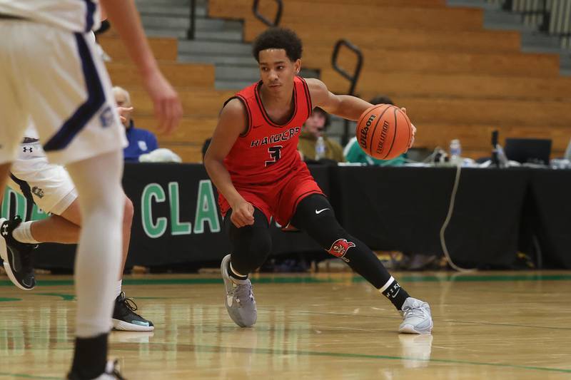 Bolingbrook’s Davion Thompson looks to make a play against St. Francis in the Jack Tosh 2023 Holiday Classic on Wednesday, Dec.27th, 2023 in York.