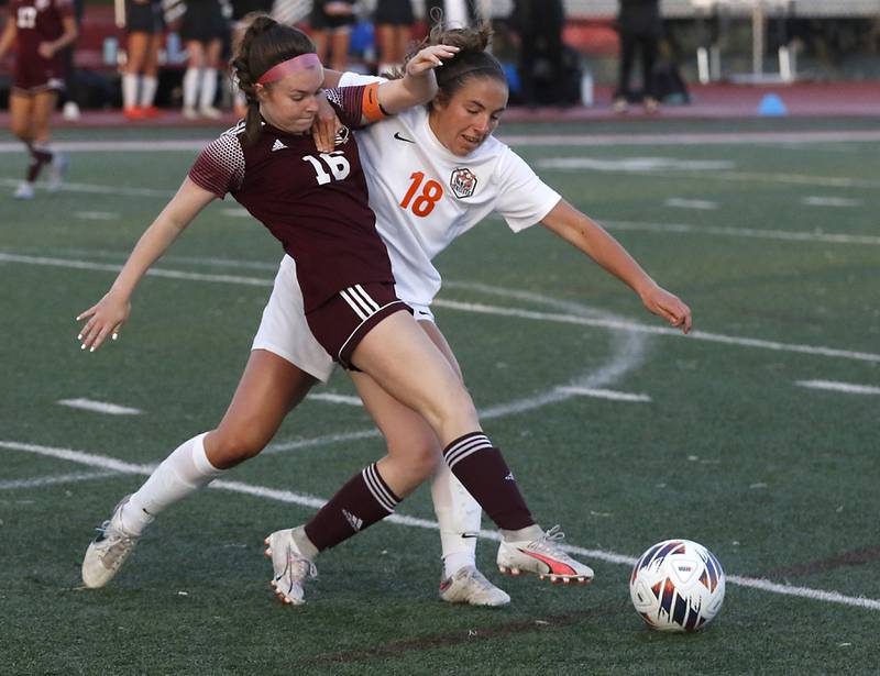 St. Ignatius College Prep's Maeve O'Meara battles with Crystal Lake Central's Sadie Quinn for control of the ball during the Class 2A Deerfield Supersectional girls soccer match on Tuesday, May 28, 2024, at Deerfield High School.