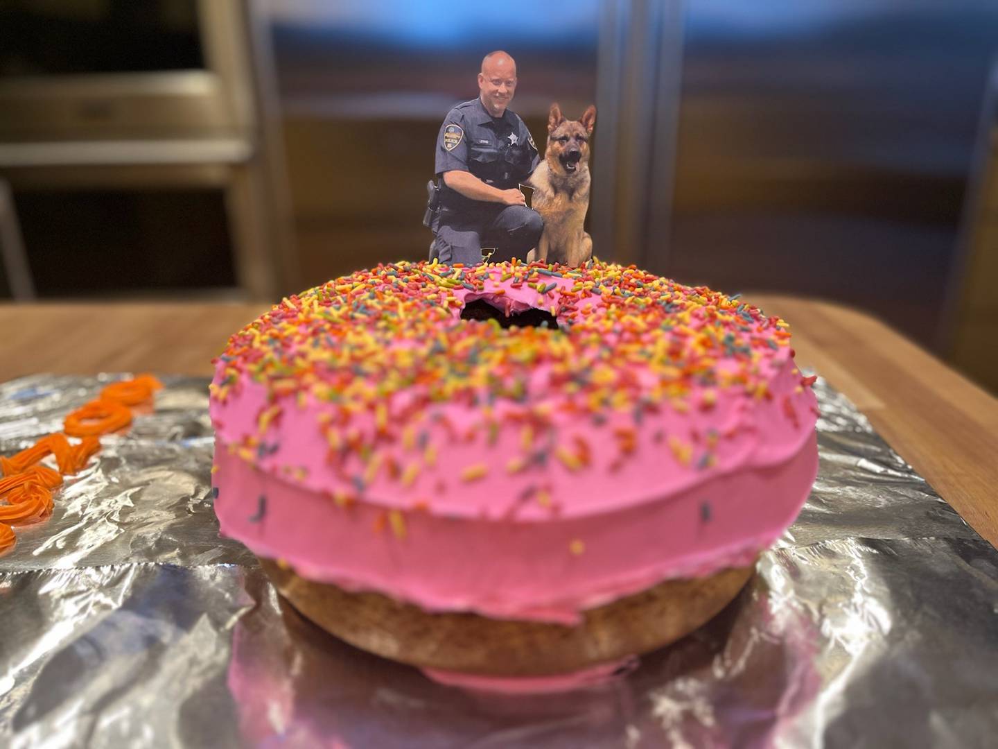 After the swearing-in ceremony for Campton Hills Police Chief James Levand on Feb. 20, 2024, supporters were treated to a in the shape of a doughnut. A cutout photo of Levand and K-9 Koda was attached.