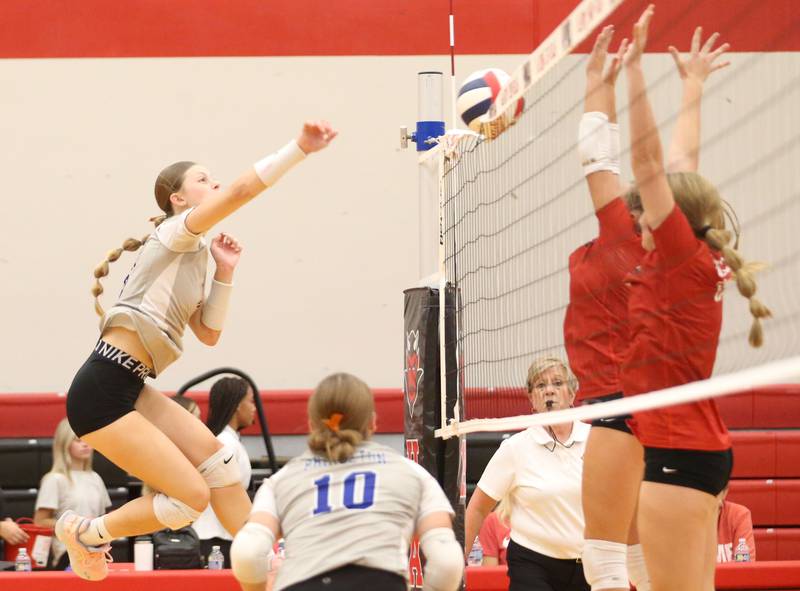 Princeton's Caroline Keutzer puts a kill on Hall on Tuesday, Sept. 17, 2024 at Hall High School.