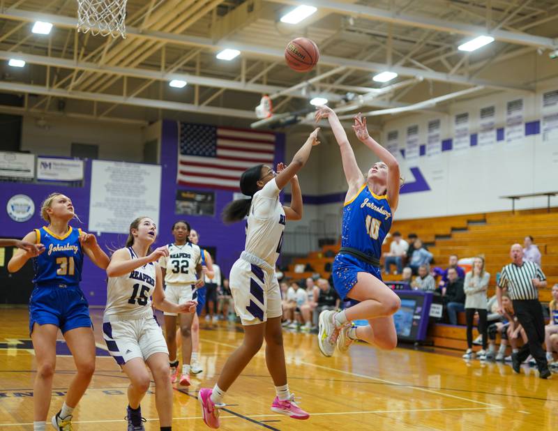 Johnsburg's Wynne Oeffling (10) shoots the ball over Plano's Jadyn Long (11) during a basketball game at Plano High School on Tuesday, Jan 30, 2024.