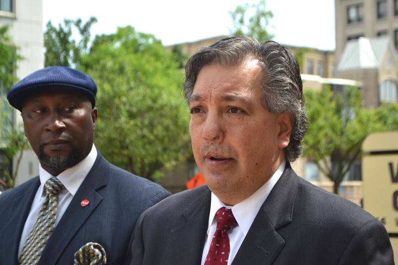Ricardo Muñoz accused his opponent, Will County State's Attorney James Glasgow, of wrongdoing when he sought a special counsel to avoid a conflict of interest in legal matters related to their race. Muñoz spoke at a news conference Friday about his claims at the Will County Courthouse in Joliet.