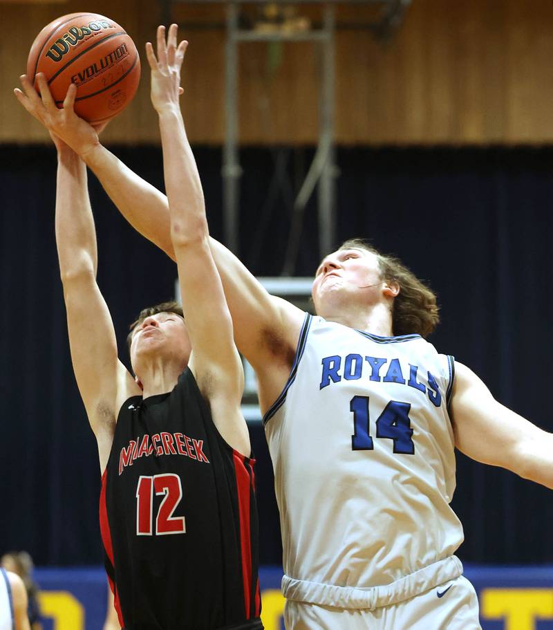 Indian Creek's Jakob McNally and Hinckley-Big Rock's Martin Ledbetter go after a rebound during their game Tuesday, Jan. 31, 2023, in the Little 10 Conference Basketball Tournament at Somonauk High School.