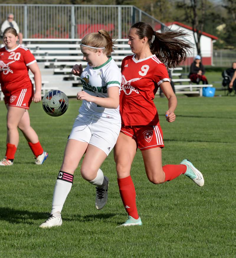 Oregon's Kenna Wubbena (9) and a North Boone player fight for the ball during a Tuesday, April 23, 2024 game at Oregon Park West.