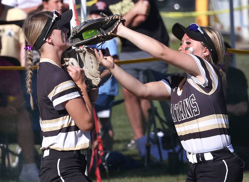 Sycamore's Addison McLaughlin (right) catches a ball just before running into teammate Faith Heil during their Class 3A sectional semifinal against Kaneland Thursday, May 30, 2024, at Sycamore High School.